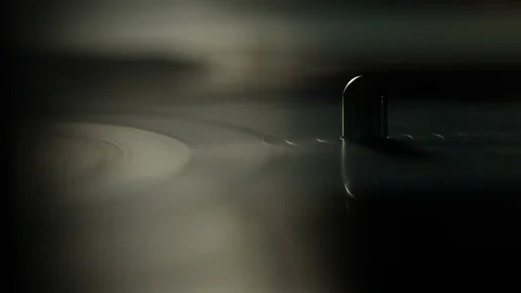 Reflection of vinyl record spinning on a turntable Stock Footage 129574390