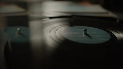 Reflection of vinyl record spinning on a turntable Stock Footage 129587681