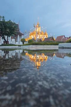 Reflection of Wat Ratchanatdaram Temple the beautiful golden castle or pagoda Stock Photos