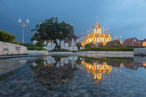 Reflection of Wat Ratchanatdaram Temple the beautiful golden castle or pagoda Stock Photos