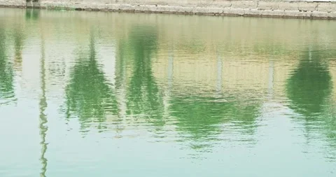 Reflection in the water of the basin of the ancient complex emir's summer Stock Footage 264139029