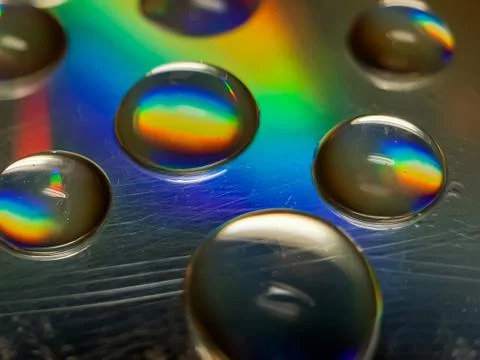 Reflection of water on CD discs. Stock Photos