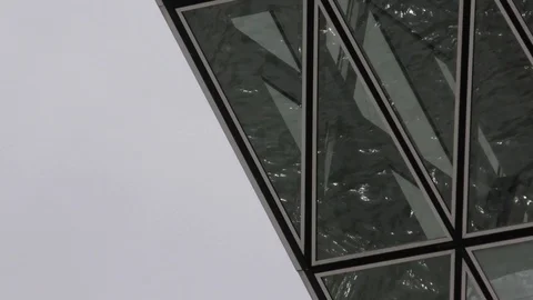 Reflection of water flowing in windows of the Port House in Antwerp (close-up) Stock Footage 113562883