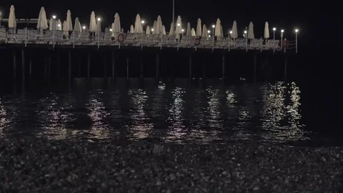 Reflection in the water of lights. Beautiful night landscape and pier. Stock Footage 82330291