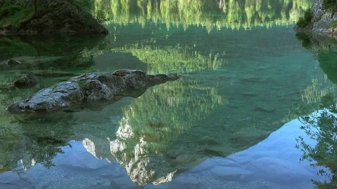 Reflection in Water of Mountain Lake. Seamless Loop Stock Footage 106460073