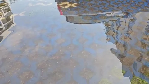 Reflection of water in The Puddle. Blue Pattern. Summer day Stock Footage 248986498