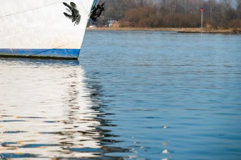 Reflection in the water of a sailboat Stock Photos