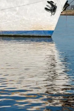 Reflection in the water of a sailboat Stock Photos