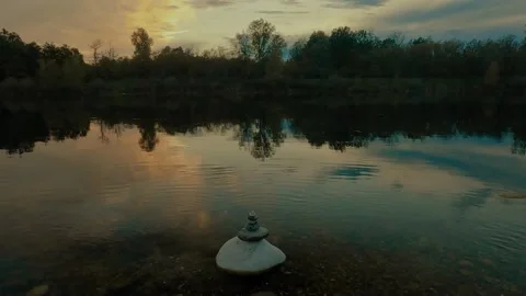 Reflection in the water with stone balance Stock Footage 220679678