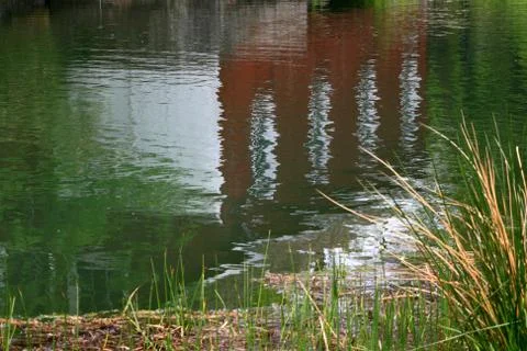 Reflection in the water of very old building. Stock Photos