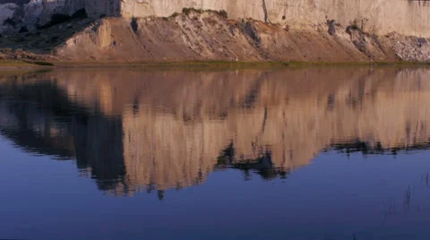 Reflection in the water of the white cliffs along the Missouri River in Montana Video stock 67665277