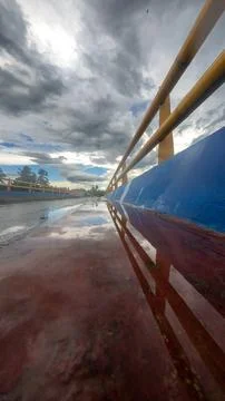 Reflection On A Wet Road Under Cloudy Sky 스톡 사진