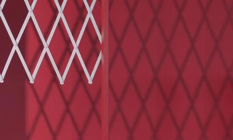 Reflection of white bars on a red wall. geometric shadows on the wall. Stock Photos