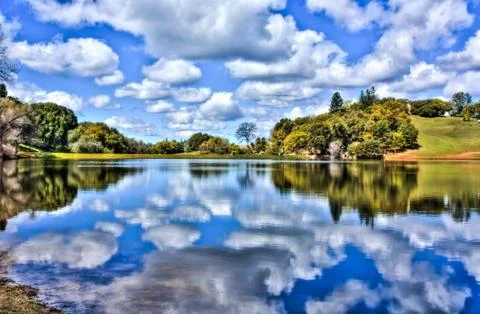 Reflection of White Clouds on the Lake. Stock Photos