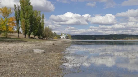 Reflection of white clouds in mountain lake Stock Footage 80996031