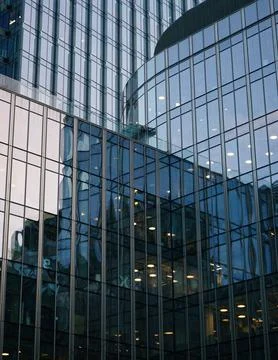Reflection in windows of modern office building. Stock Photos