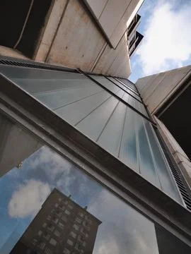 Reflection in the windows of a modern office building in a city os Spain Stock Photos