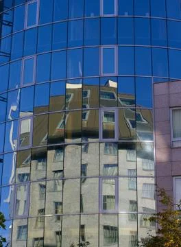 Reflection in the windows of a office building Stock Photos