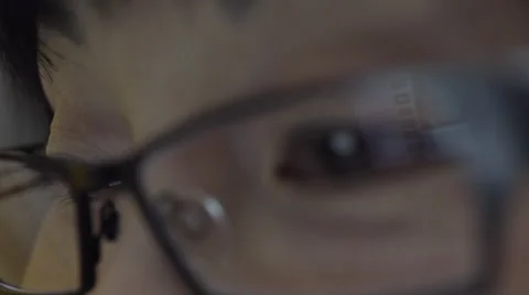 Reflection on woman's eyeglasses. 4K UHD. Видео 49592886