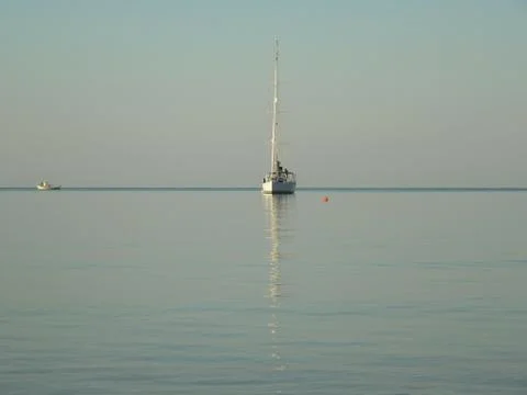 Reflection of a yacht. Stock Photos