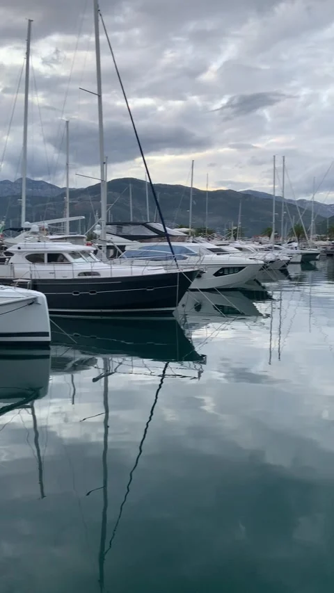 Reflection of the yachts port of Montenegro Stock Footage 234126560
