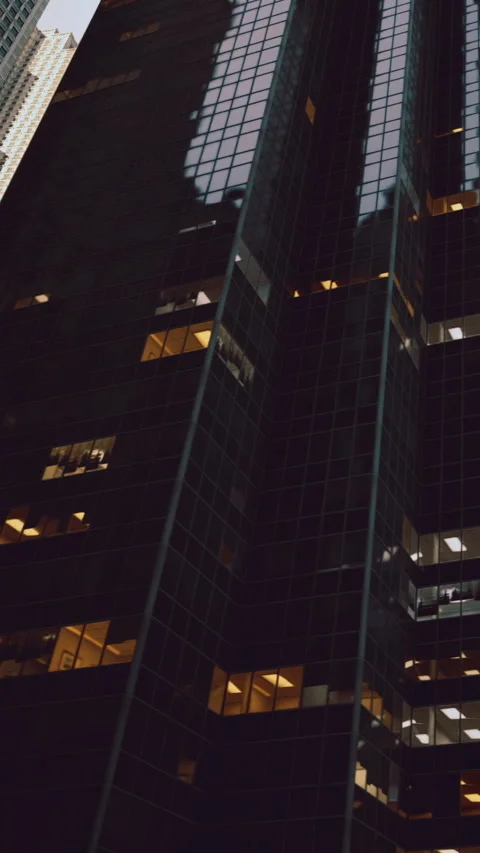 Reflections and shadows dance on towering glass buildings in the city Stock Footage 331695204