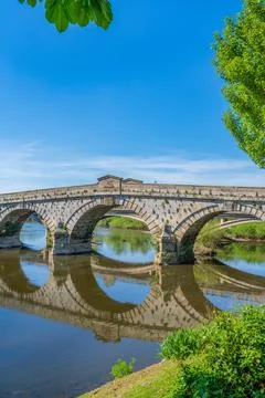 Reflections of Atcham bridge in the still River Severn in Atcham, Shropshire Stock Photos