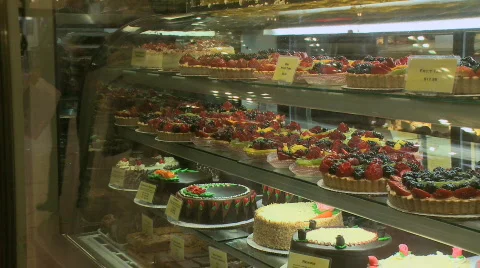 Reflections in a bakery window Stock Footage 560571