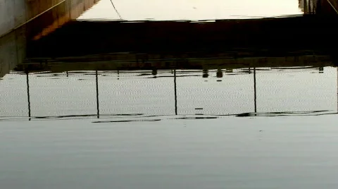 Reflections of beach boardwalk Stock Footage 110356