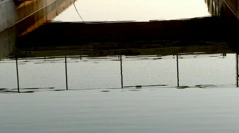 Reflections of beach boardwalk Stock Footage 110360
