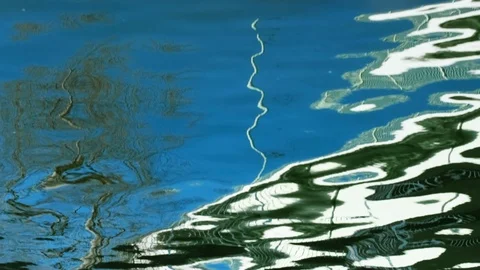 Reflections of a bridge and a tree broken by waves 스톡 동영상 123291508
