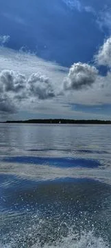 Reflections in a Calm Lake with Clouds Stock Photos