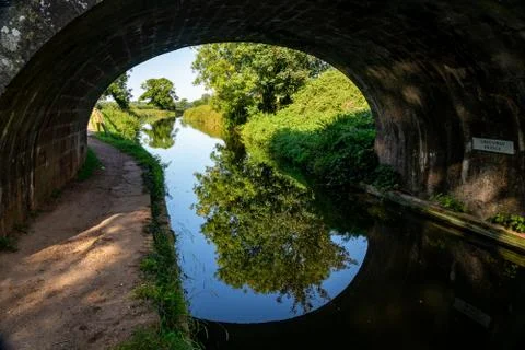 Reflections of a canal bridge Stock Photos