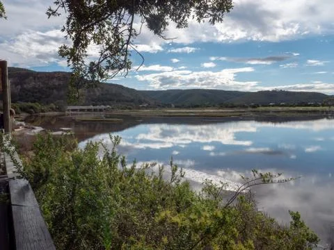 Reflections of clouds on water. Stock Photos