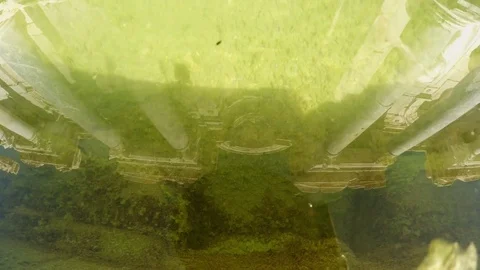 Reflections of Columns in Clear Water in Pond of Old Fountain Centre of Stock Footage 75324473