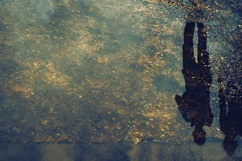 Reflections. Defocused blurred background with reflections in the city marsh. Stock Photos