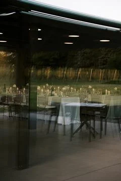 Reflections of Elegant Outdoor Dinner Tables at Dusk Stock Photos