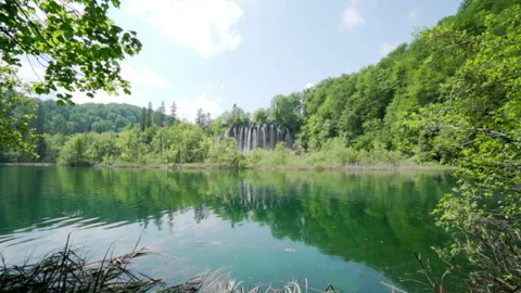 Reflections of forest and clouds on Plitvice lake Stock Footage 319766628