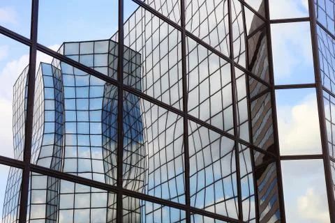 Reflections in glass facade Stock Photos