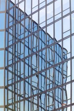 Reflections on glass facade Stock Photos