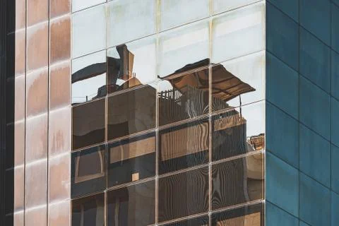 Reflections on a glass facade Stock Photos