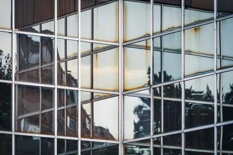 Reflections on a glass facade Stock Photos