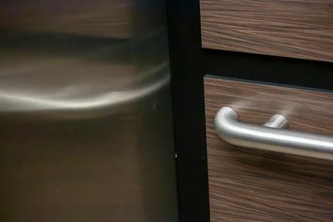 Reflections of the handrail in an elevator Stock Photos