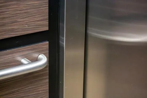 Reflections of the handrail in an elevator Stock Photos