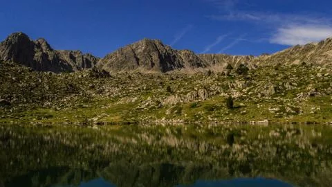 Reflections in a high-mountain lake. Stockfoto's
