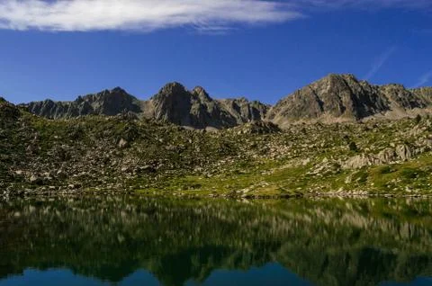 Reflections in a high-mountain lake. Stock Photos