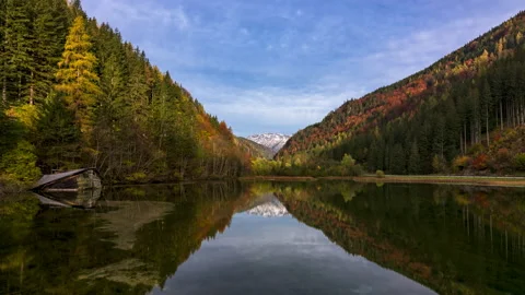 Reflections in a lake with a collapsed cabin timelapse Stock Footage 143419513