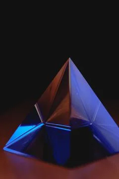 Reflections of light and color captured in a glass prismatic pyramid Stock-Fotos