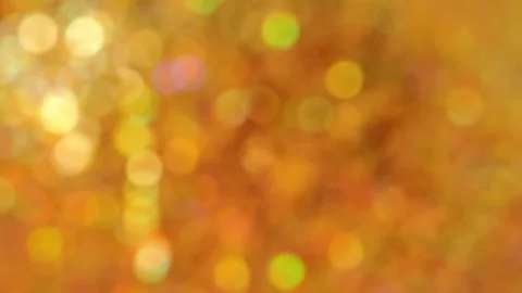Reflections of light on a golden background with multicolored bokeh Stock Footage 318981774