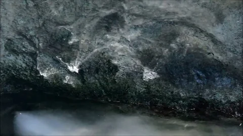 Reflections of light from water on a rock Stock Footage 77862578